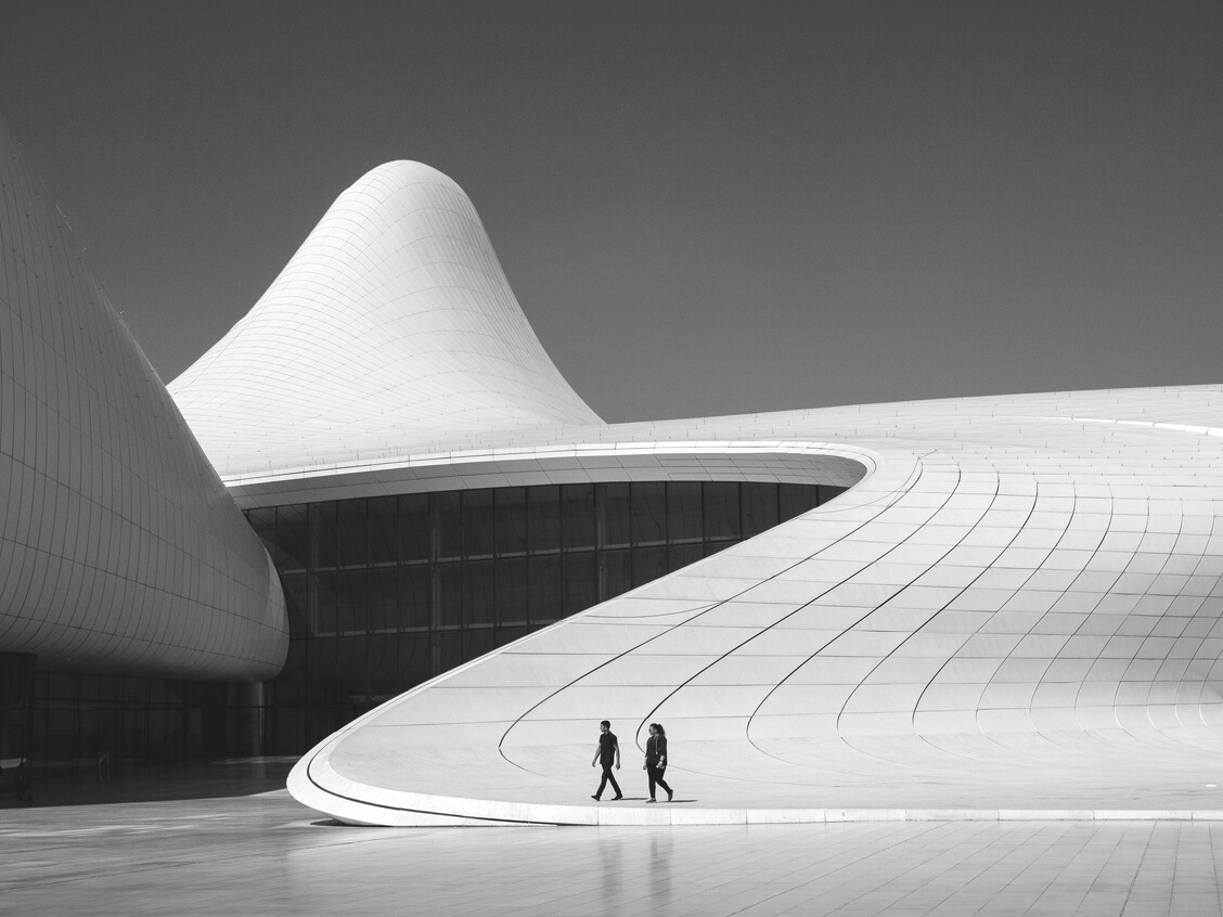 People walking outside modern building